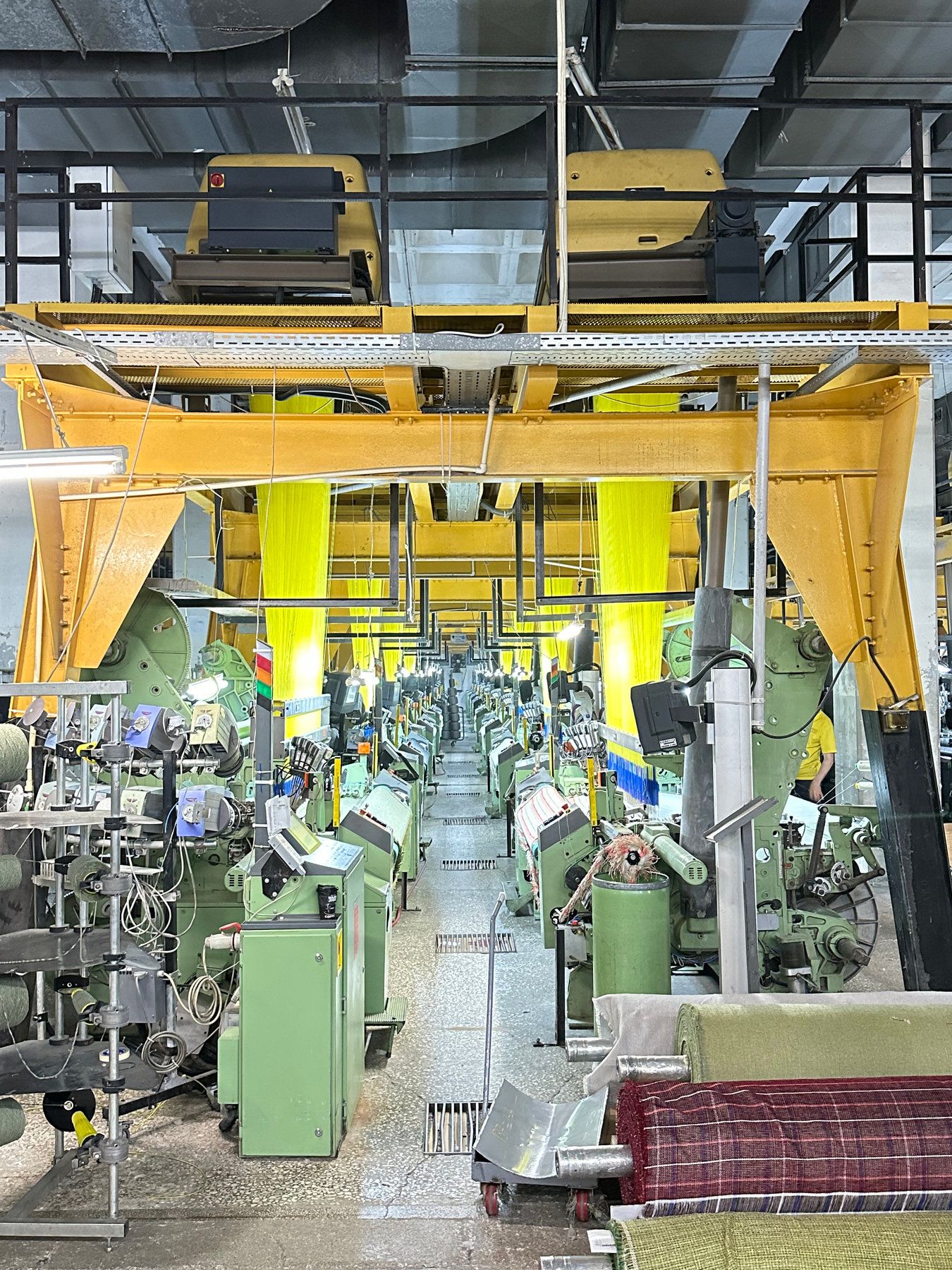 A mill floor lined with jacquard looms